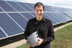 Ampt LLC’s chief executive Levent Gun holds one of the Fort Collins-based company’s DC power optimizers that reduces the cost of solar installations. Image courtesy Ampt LLC