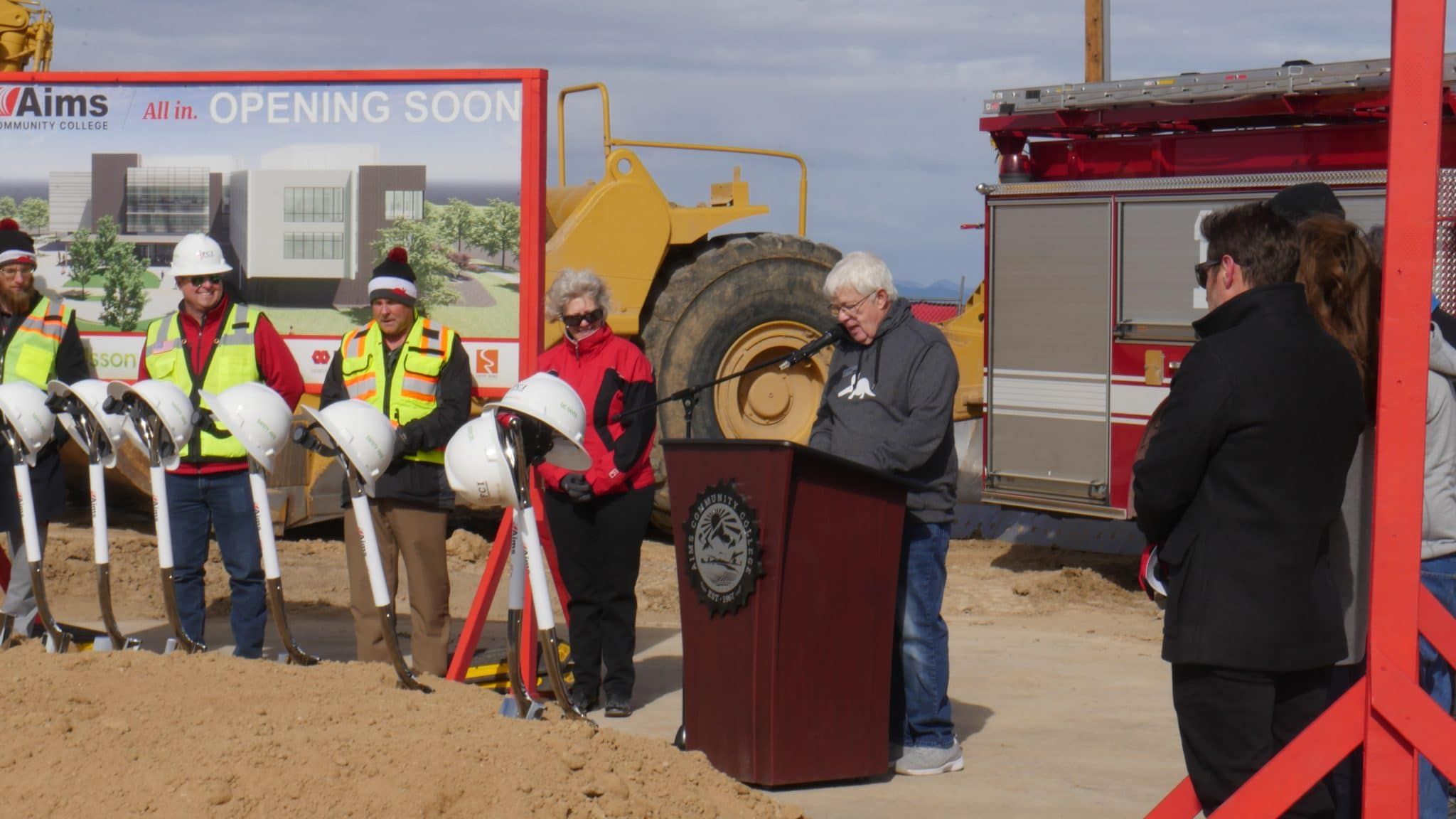 Lyle Achziger stands on a construction site at Aims Community College's Windsor expansion