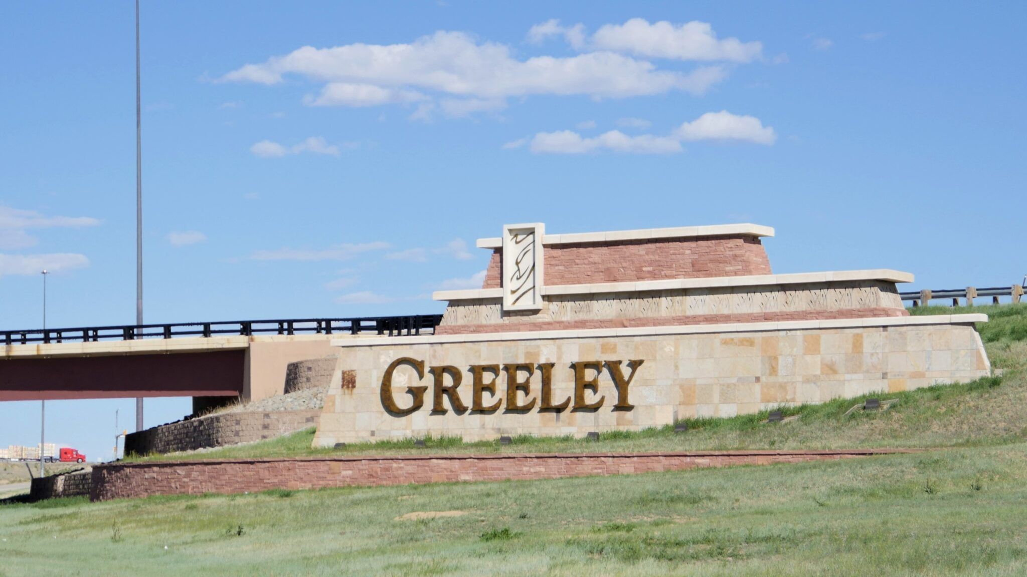 The sign as travelers enter Greeley