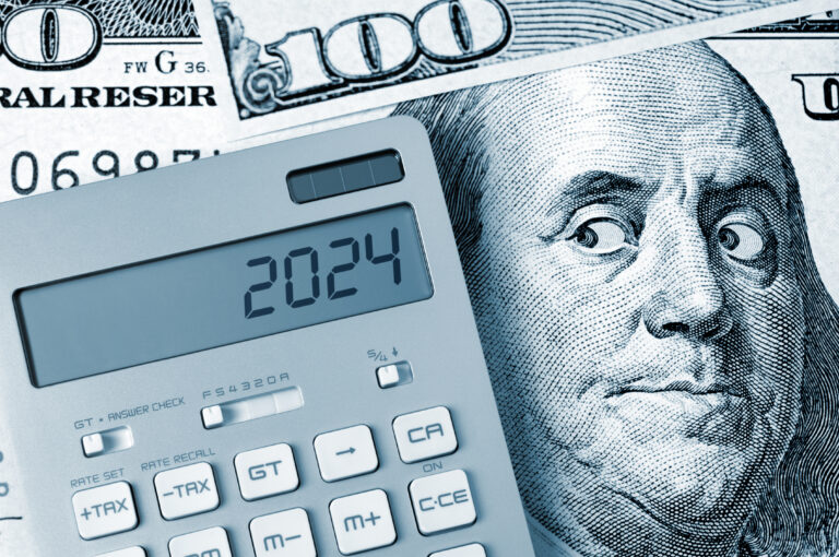 Image of $100 bill and a calculator, with 2024 on the calculator screen.