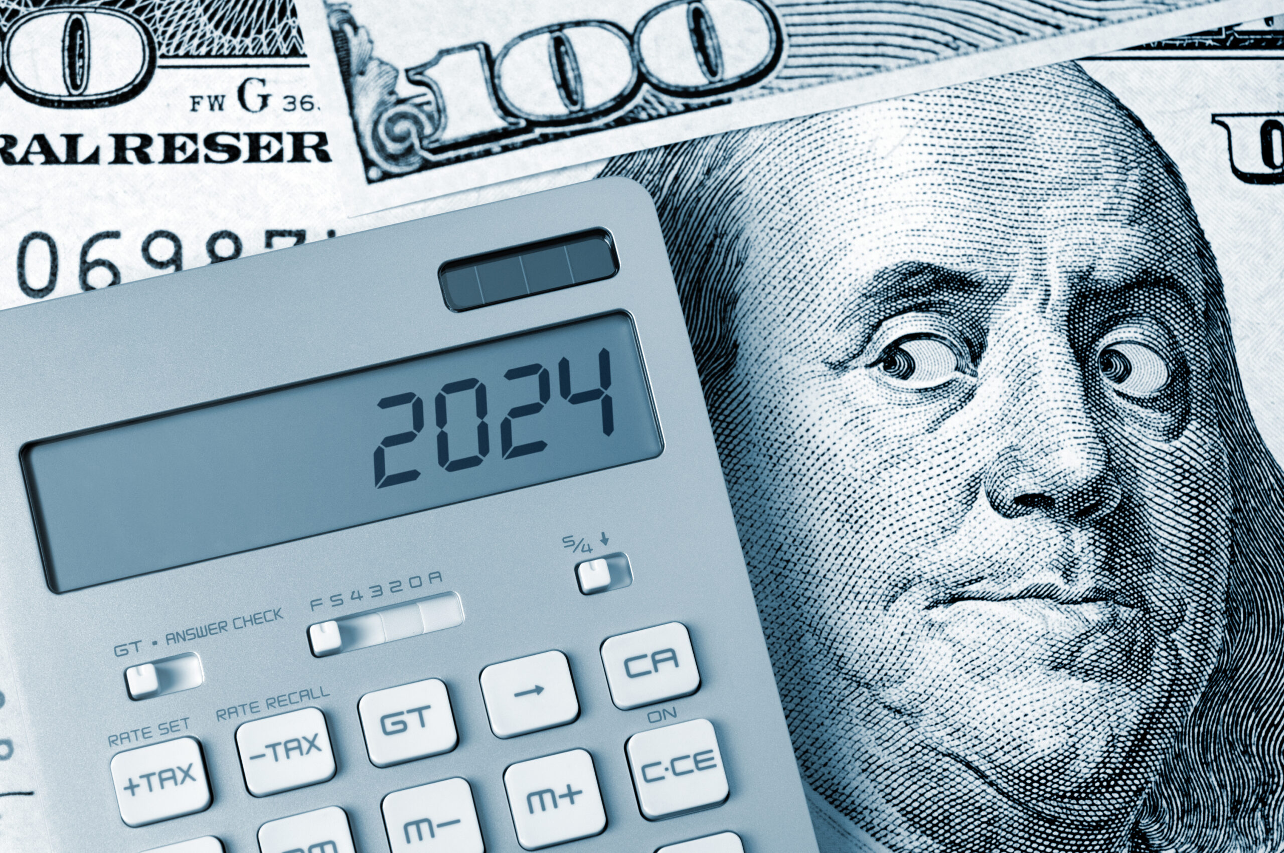 Image of $100 bill and a calculator, with 2024 on the calculator screen.