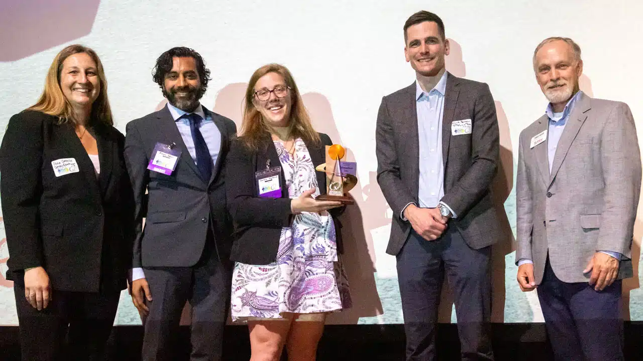 From left, IQ Awards event sponsor Gina Cornelio of Dorsey & Whitney LLP, Ashwin Salvi and Sarah Heyborne of AtmosZero accepting the IQ Award for Technology, event sponsor Mark Berman of JP Morgan Chase and Chris Wood, BizWest publisher. Courtesy Dick’s Photography for BizWest