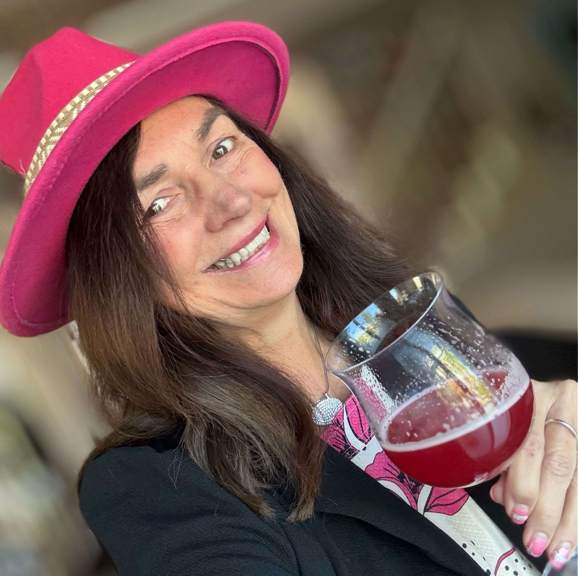 Dixie Daly posing with a Tickled Pink beer.