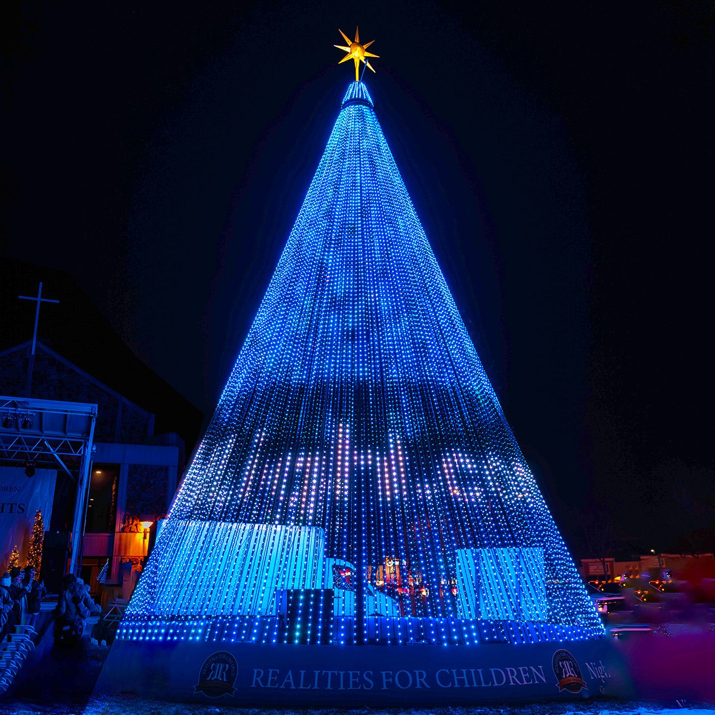 Blue lights in the shape of a Christmas Tree for Realities for Children.