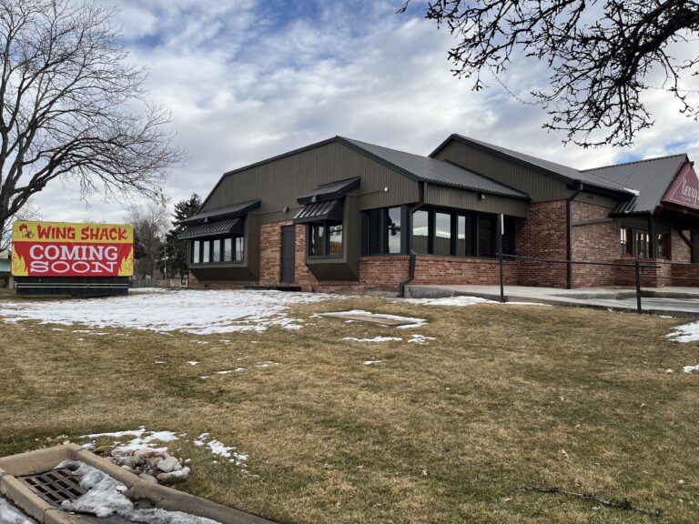 building with new Wing Shack sign