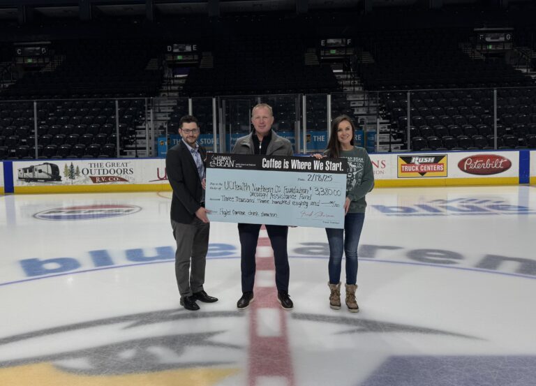 Human Bean presenting donation.