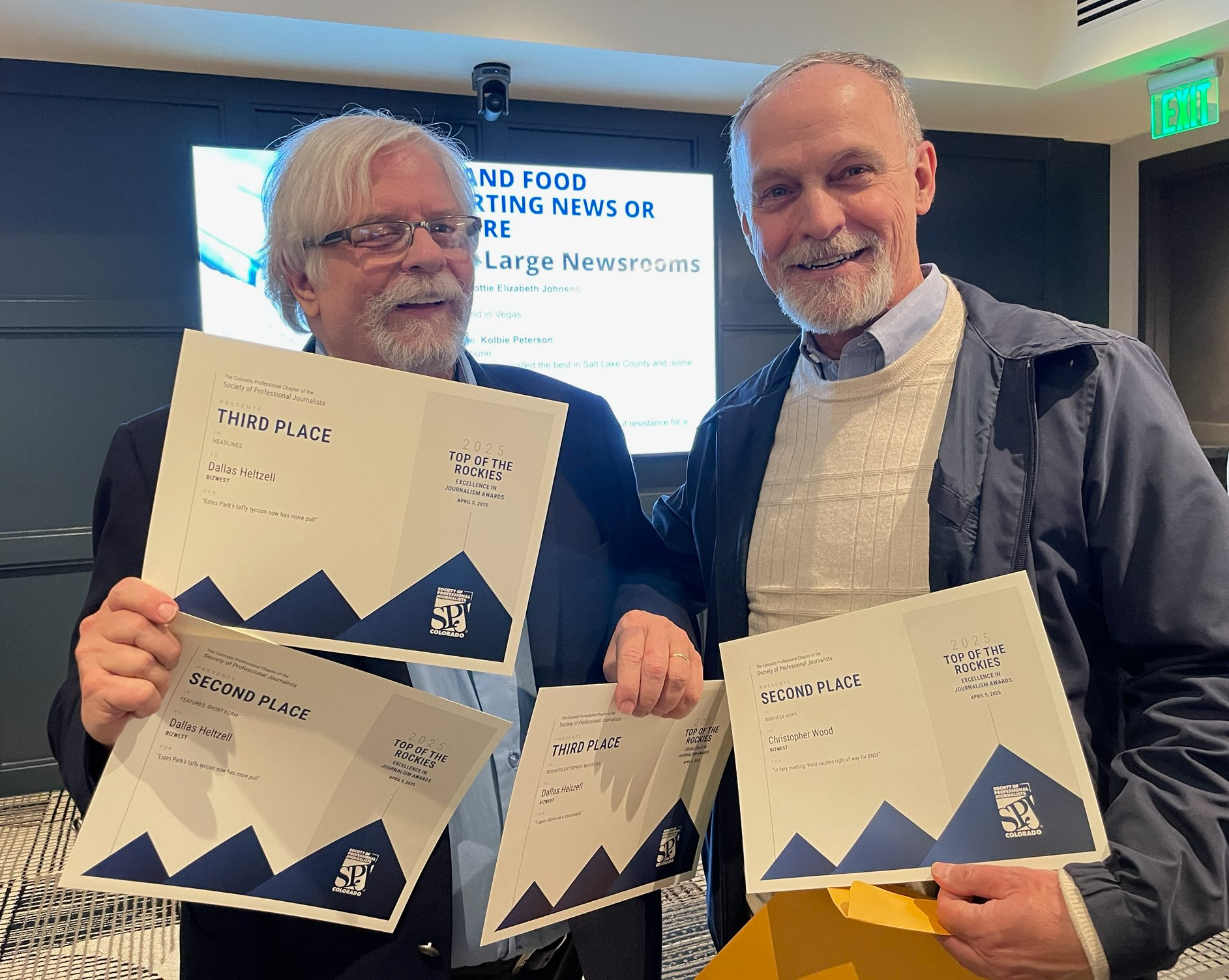 BizWest reporter Dallas Heltzell, left, and editor and publisher Christopher Wood display their award certificates Saturday at the Top of the Rockies Excellence in Journalism competition, sponsored by the Colorado chapter of the Society of Professional Journalists.