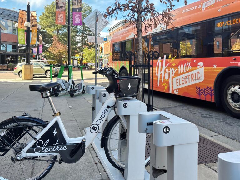 ebike parked next to a bus