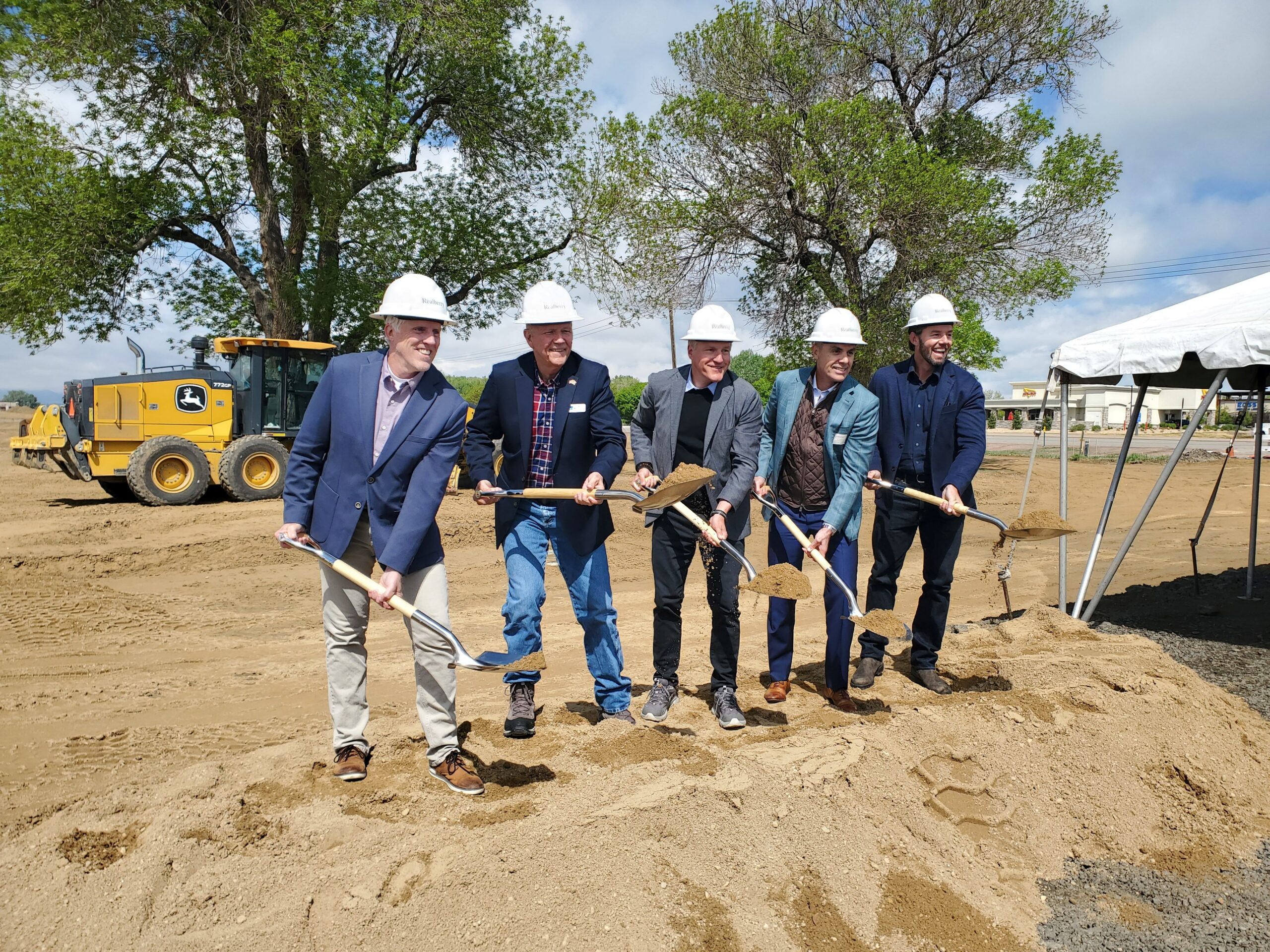 Taking part in the groundbreaking for Avenue South Tuesday in Loveland are, from left: Todd Parker, vice president for commercial, mixed use, at Realberry; Loveland mayor Patrick McFall; Troy McWhinney, co-founder and principal at Realberry; Brad Jeanneret, president and CEO of Hensel Phelps Construction Co.; and Stenn Parton, founder and CEO of Prism Places Inc.