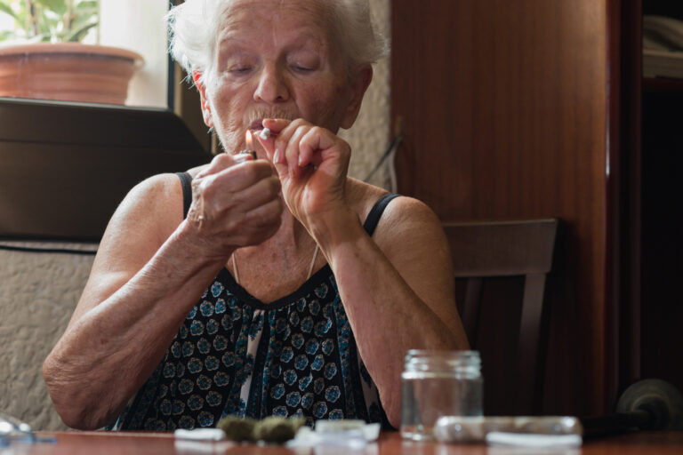 iStock image of older woman smoking marijuana