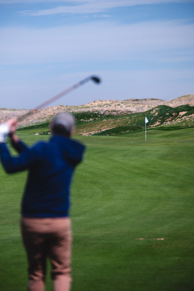A golfer takes aim at a Rodeo Dunes green.